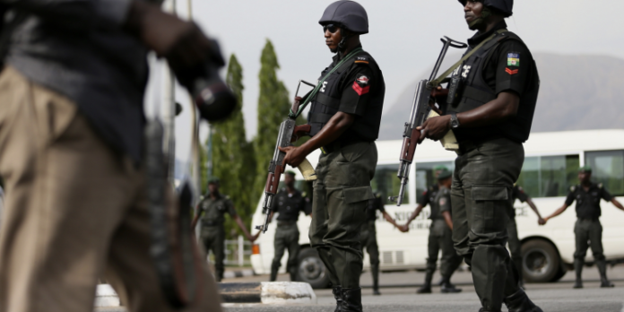 Picture shows two Nigerian Policemen wielding their riflles